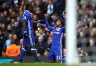 MANCHESTER, ENGLAND - DECEMBER 03:  Willian (R) of Chelsea celebrates scoring his team's second goal with his team mate Victor Moses (L) during the Premier League match between Manchester City and Chelsea at Etihad Stadium on December 3, 2016 in Manchester, England.  (Photo by Clive Brunskill/Getty Images)